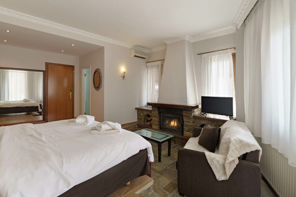 Luxe Room with Fireplace and Jacuzzi at Prestige Hotel